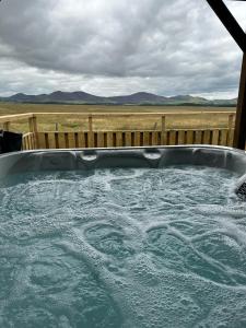 a large jacuzzi tub with water in it at East Kip - Dog Friendly in Penicuik