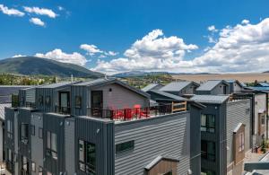 a row of houses with mountains in the background at Fourth Street Crossing Traverse Townhome: Stylish Retreat in Silverthorne