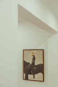 a picture of a person riding a horse in a frame at 3 bedroom apartment in Cacém in Paiõis