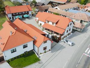 an overhead view of a house with orange roofs at Nagy-Homoród Étterem és Panzió in Rareş