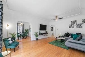 a living room with a couch and a table at Beverly Hills Stylish & Central 1 BR Apt + Parking in Los Angeles