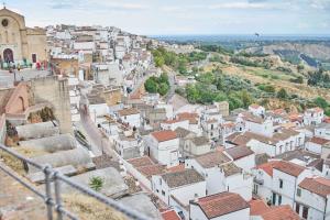 an aerial view of a town with white buildings at nonnanina in Pisticci