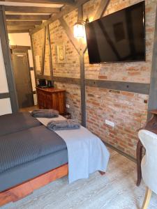 TV a/nebo společenská místnost v ubytování Hotel b&b altes hinterhäusel