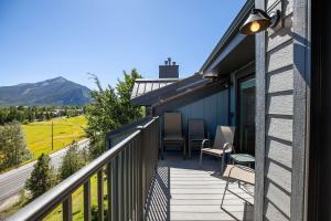 a balcony with chairs and a view of a mountain at Lake Forest Lakeview Long Stay Condo: Fantastic Location, Views in Frisco