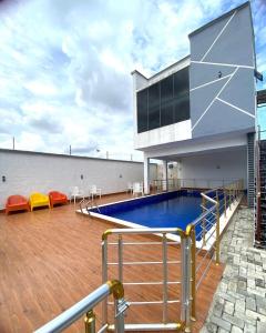 a swimming pool on the roof of a building at Homely Shortlet Apartment LBS, AJAH in Lagos