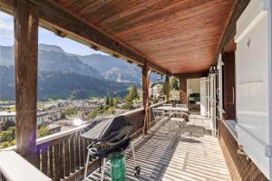 a balcony with a view of the mountains at Sunny Design Chalet in Engelberg with spectacular view on Mount Titlis in Engelberg