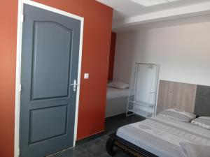 Postel nebo postele na pokoji v ubytování L'améthyste