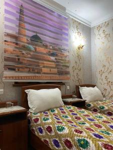 Giường trong phòng chung tại Khiva Otabek B&B Hotel