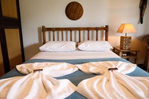 Un pat sau paturi într-o cameră la Solar da Teresa