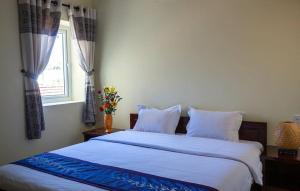 Postel nebo postele na pokoji v ubytování Harmony Hoian Homestay