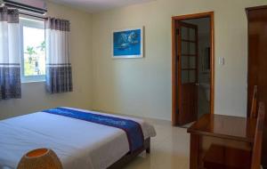 Postel nebo postele na pokoji v ubytování Harmony Hoian Homestay