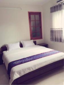 Postel nebo postele na pokoji v ubytování Harmony Hoian Homestay
