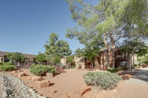 a park in front of a building with trees at The Painted Pony Condo with Pool and Gym Access! in Sedona