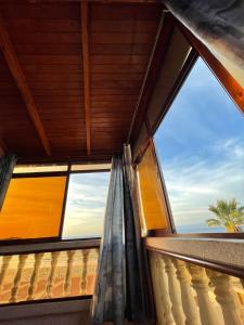 a window in a room with a view of the ocean at Appartement el hichou 1 in Ksar es Sghir