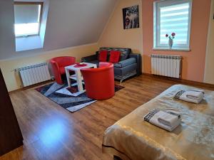 a living room with a couch and a table at Agroturystyka Gazdówka in Zakliczyn +24 photos