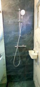 a bathroom with a shower and a sink at D&C Studio II/Self-Check-In in Bucharest +8 photos