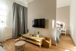 TV a/nebo společenská místnost v ubytování Apartmány KRAKENS