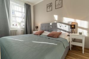 Posteľ alebo postele v izbe v ubytovaní Apartmány KRAKENS