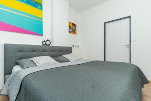 Postel nebo postele na pokoji v ubytování Apartmány KRAKENS