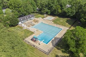 an overhead view of a large swimming pool in a yard at Townhome in No VA, 40 Mins to DC, Pets OK, Fast WiFi in Sterling