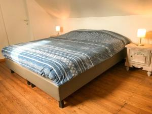 Postel nebo postele na pokoji v ubytování Vakantiewoning Heidebos in het Nationaal Park Hoge Kempen
