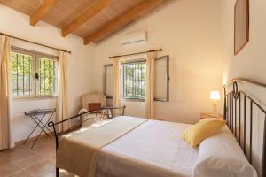 Llit o llits en una habitació de Villa La LLar Clara
