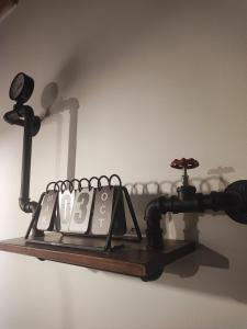 a shelf with a microscope on a wall at Loft Porta Sud Civ.33 in Brindisi
