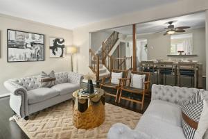 a living room with two couches and a dining room at Sleeps 6, Nature trails, 40 Mins to DC, 2 cars MAX in Sterling