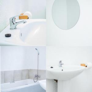 a white bathroom with a sink and a mirror at JBC Guest House in Bushbuckridge