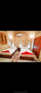 Ένα ή περισσότερα κρεβάτια σε δωμάτιο στο Al Burj Hotel