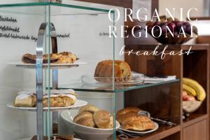 a glass display case with different types of pastries at Hotel Spiess & Spiess in Vienna