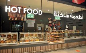 a hot food store with a lot of different pastries at luxury apartments in cairo , porto new cairo , nyum in Cairo