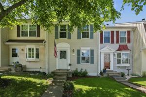a house with a flag in front of it at Luxury Sterling townhome - Private, Self checkin in Sterling