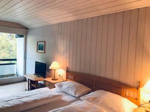 Letto o letti in una camera di Hotel Daneu Gaschurn