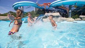 a group of people playing in a swimming pool at Hotel ITALY in Misano Adriatico