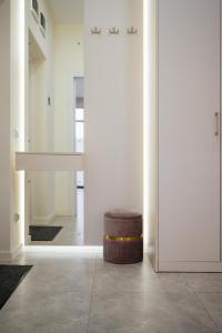 a ottoman sitting in the middle of a room at Luxury Apartments “Dream City” in Uzhhorod