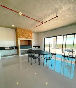 a dining room with a table and chairs at Confortable apto. en Asunción. in Luque