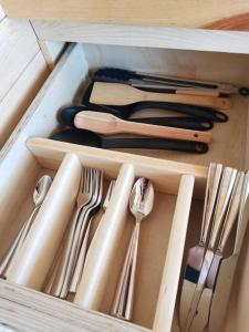 a drawer filled with utensils and utensils at Bosques del Cielo in Los Lirios