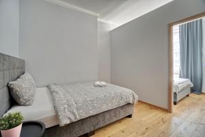 Posteľ alebo postele v izbe v ubytovaní Warsaw Premium Apartments Deluxe Old Town