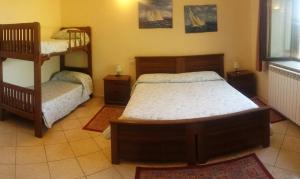 a bedroom with two bunk beds and a window at Agriturismo Il Poderino in Tarquinia +6 photos