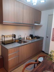 A kitchen or kitchenette at Arezzo Place Davao- Carol