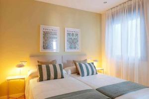 Ένα ή περισσότερα κρεβάτια σε δωμάτιο στο El Sueño De Elba By Silastur