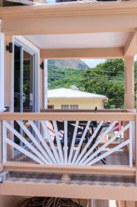 a view from the balcony of a house at Maggie's Inn in Soufrière