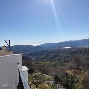 a view of the mountains from a house at Apartamento vacacional en la Alpujarra in Laroles