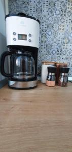 a coffee maker sitting on top of a counter at D&C Studio II/Self-Check-In in Bucharest