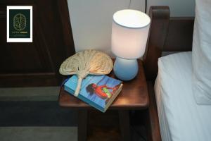 Postel nebo postele na pokoji v ubytování Coffee Shade
