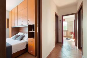 a bedroom with a bed and a door to a hallway at Una Finestra Sulle Montagne in Albavilla