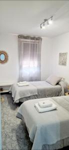 A bed or beds in a room at Apartamento Casa Tambo, Campelo