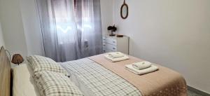 A bed or beds in a room at Apartamento Casa Tambo, Campelo