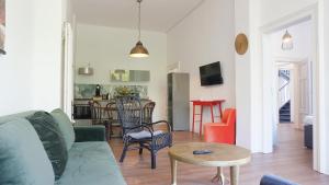 a living room with a couch and a table at Heger Tor Apartments in Osnabrück
